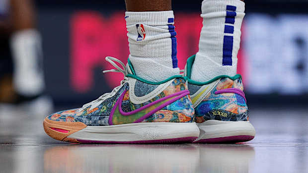 View of rainbow-colored Nike shoes.